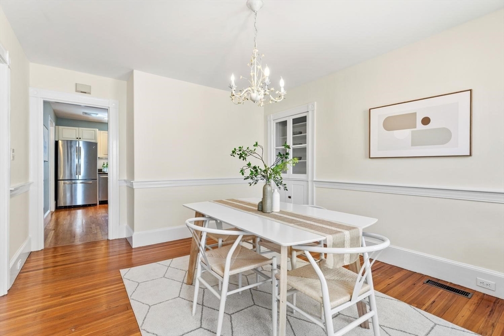 9 Governors Avenue, Unit 2 Winchester, MA 01890 - Photo 9 of 37 a view of a dining room with furniture and wooden floor