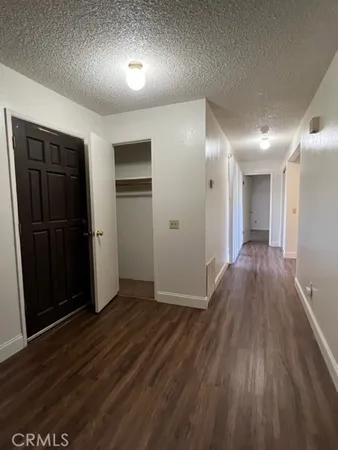a view of bedroom with wooden floor