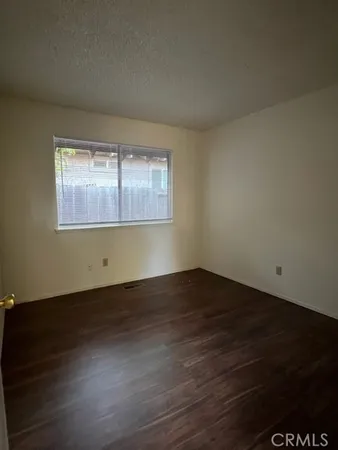 a view of wooden floor in an empty room