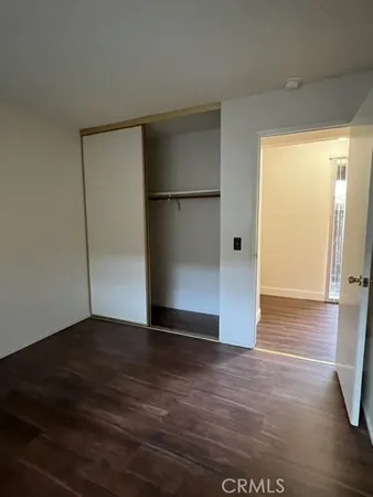 a view of hallway with wooden floor