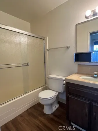 an empty room with wooden floor
