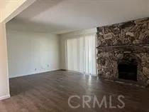 a kitchen with a sink and a stove next to a window