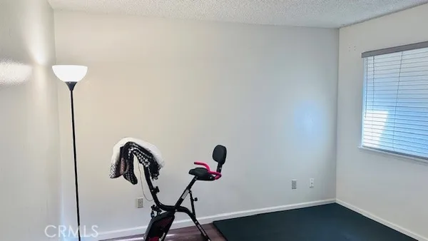 a room with a window a washer and dryer