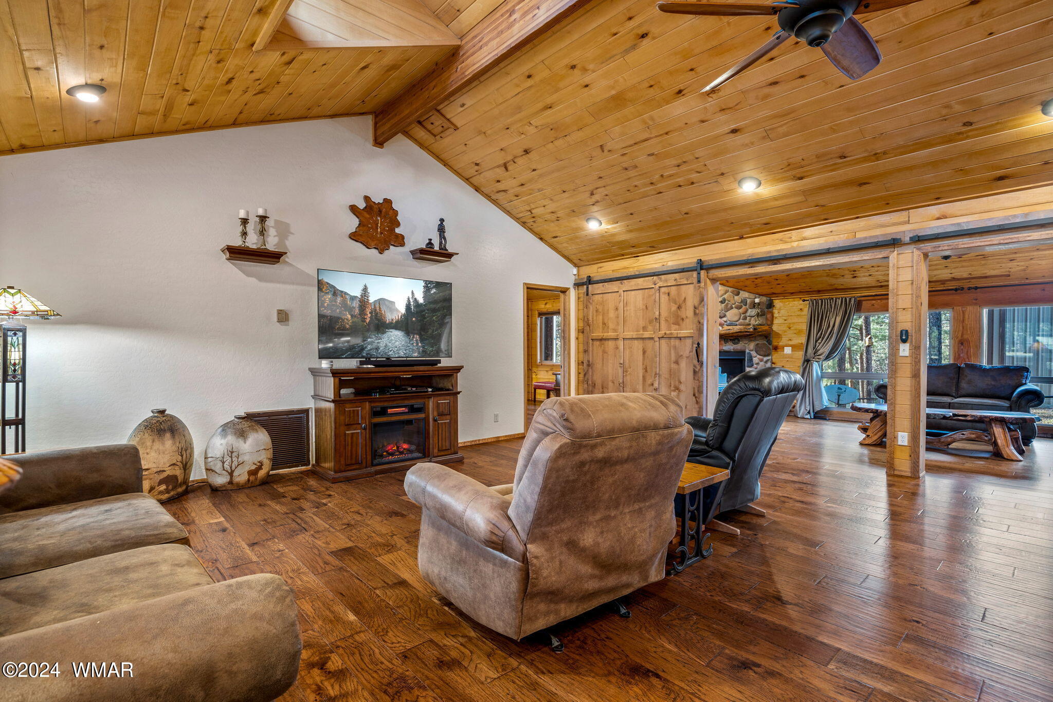 3122 Chevelon Road Overgaard, AZ 85933 - Photo 8 of 57 a living room with furniture and wooden floor