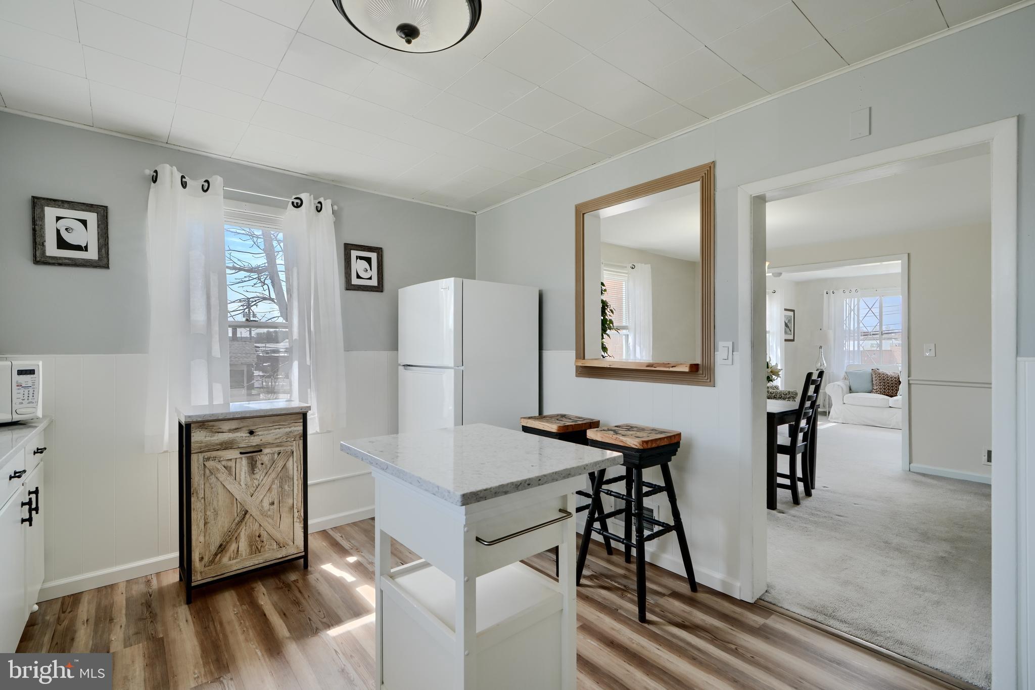 209 Middle River Road Baltimore, MD 21220 - Photo 12 of 35 a view of a livingroom with furniture and wooden floor