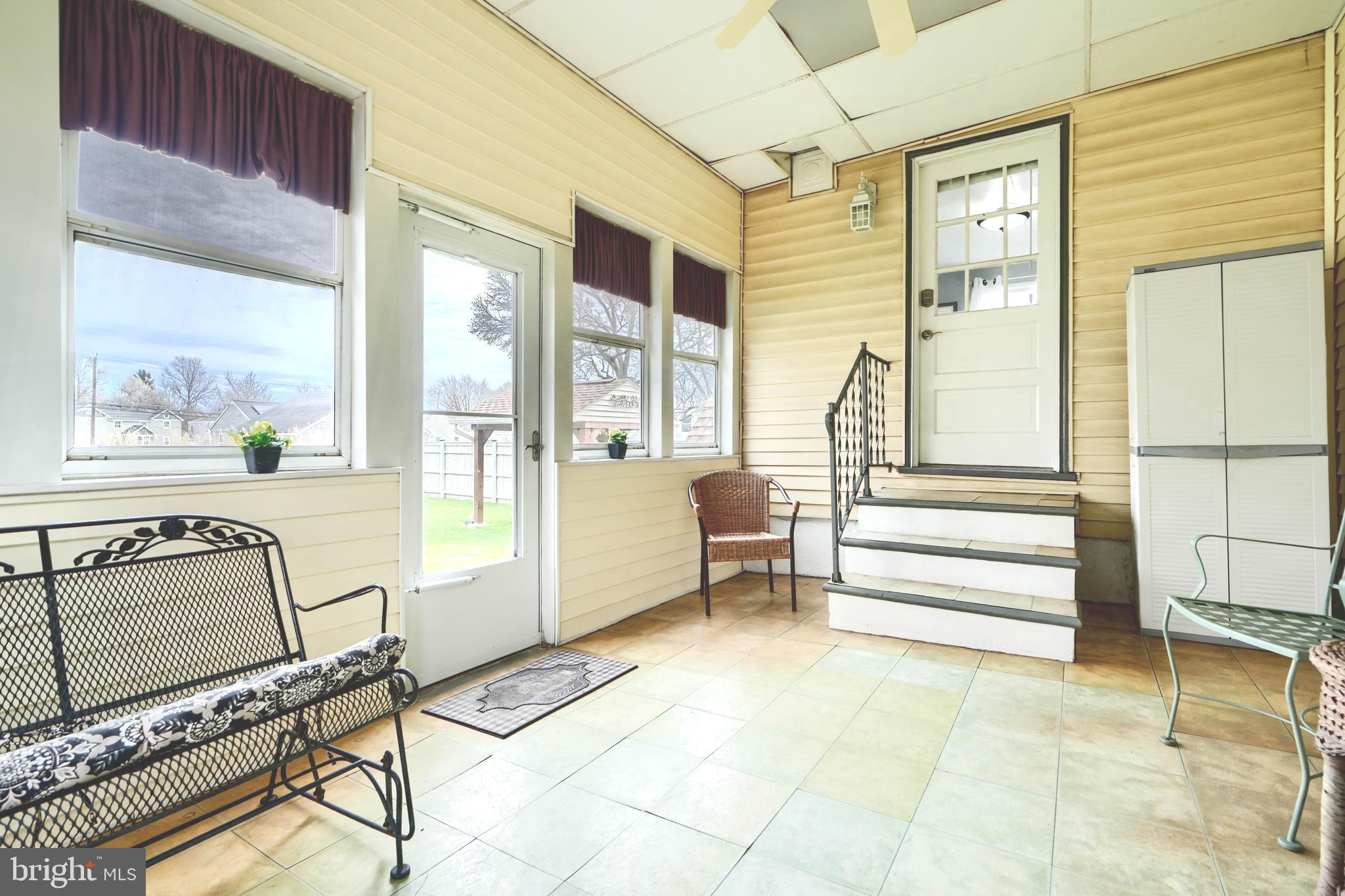 209 Middle River Road Baltimore, MD 21220 - Photo 14 of 35 a view of staircase with a rug and a window
