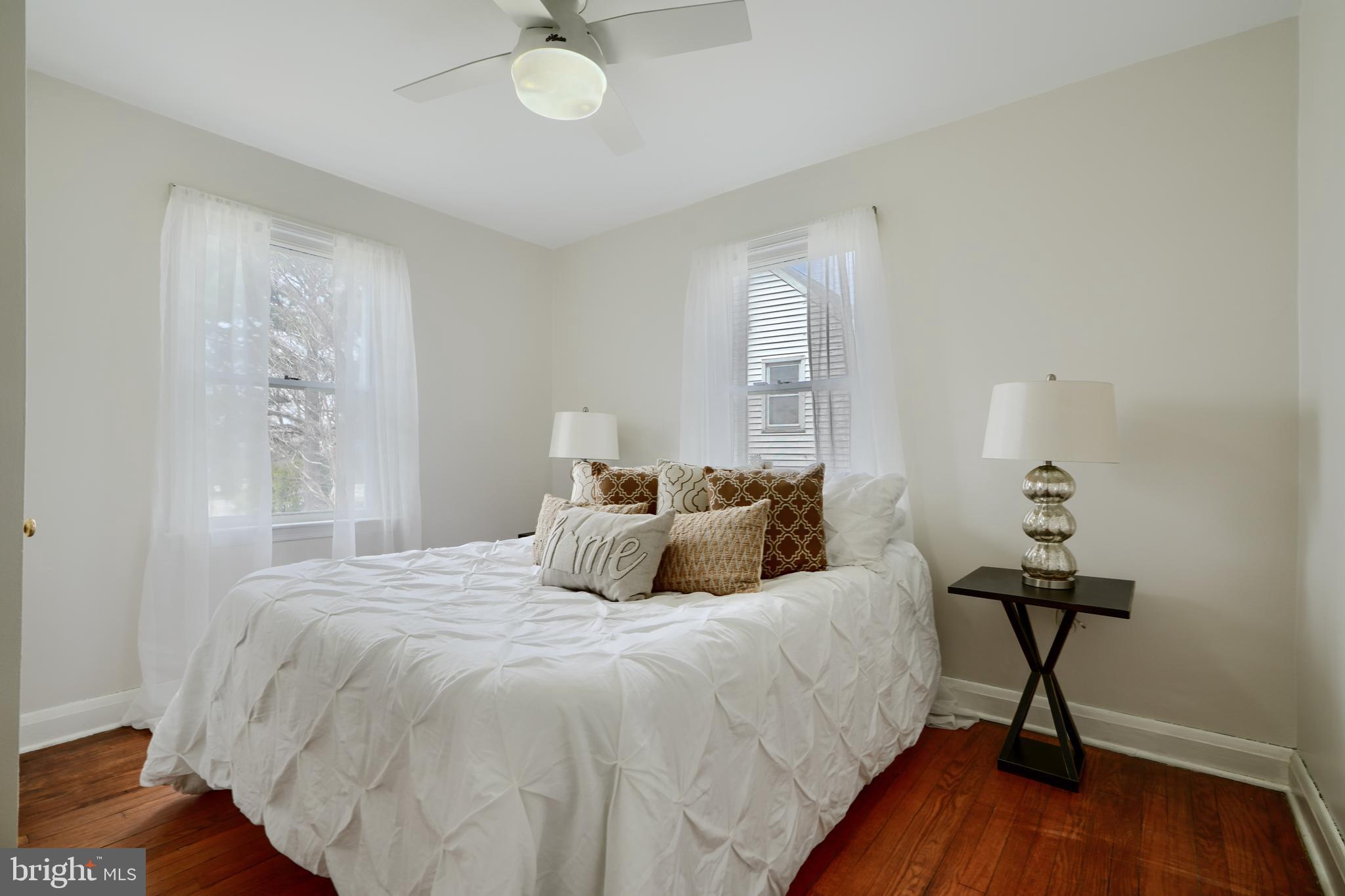 209 Middle River Road Baltimore, MD 21220 - Photo 16 of 35 a bedroom with a bed and wooden floor