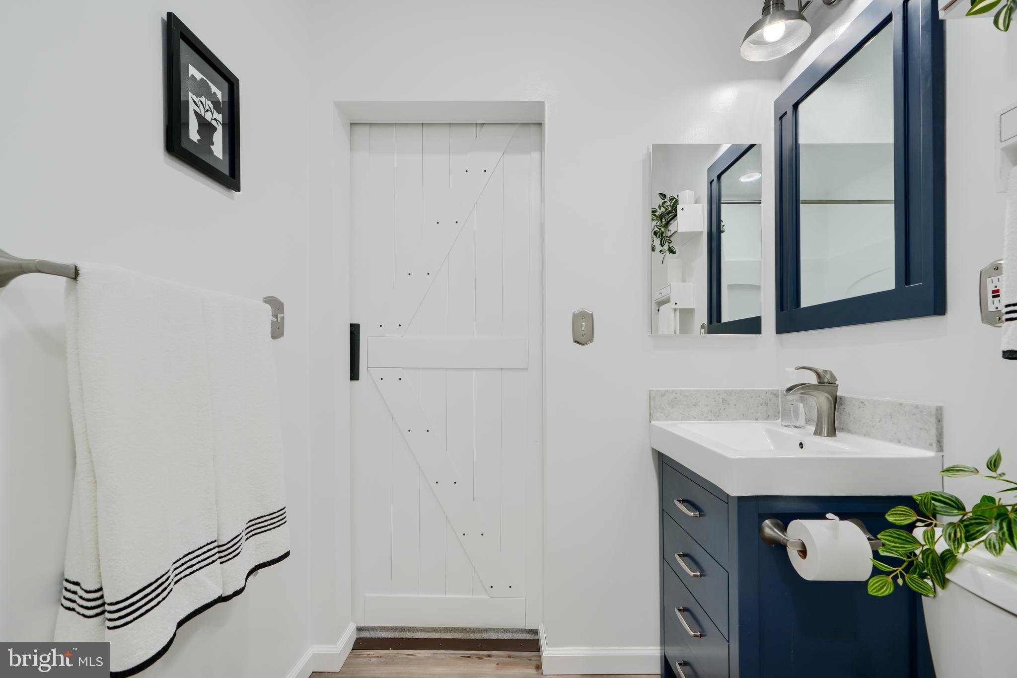 209 Middle River Road Baltimore, MD 21220 - Photo 21 of 35 a bathroom with a sink and a mirror