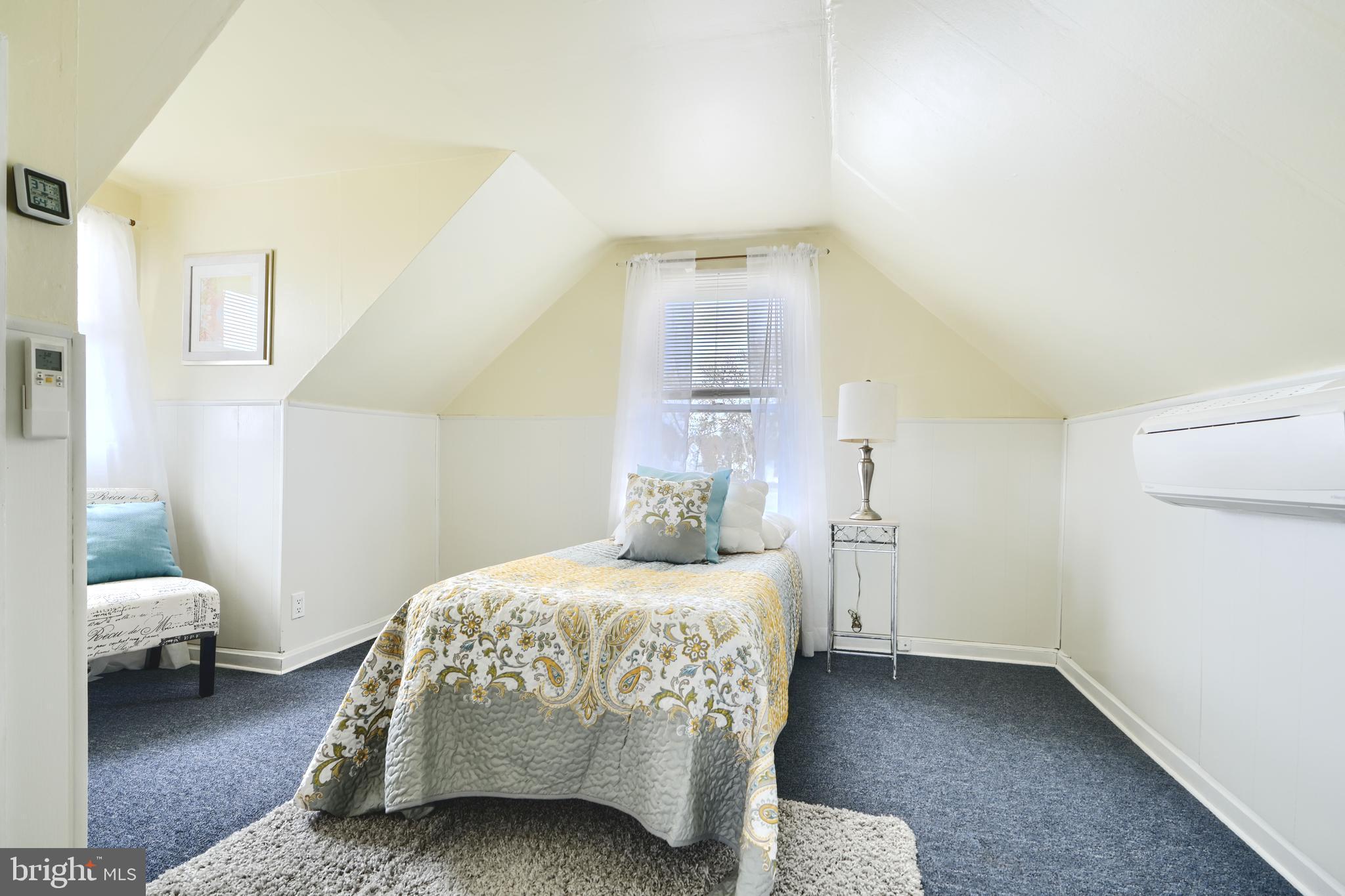 209 Middle River Road Baltimore, MD 21220 - Photo 25 of 35 a bedroom with a bed and a couch