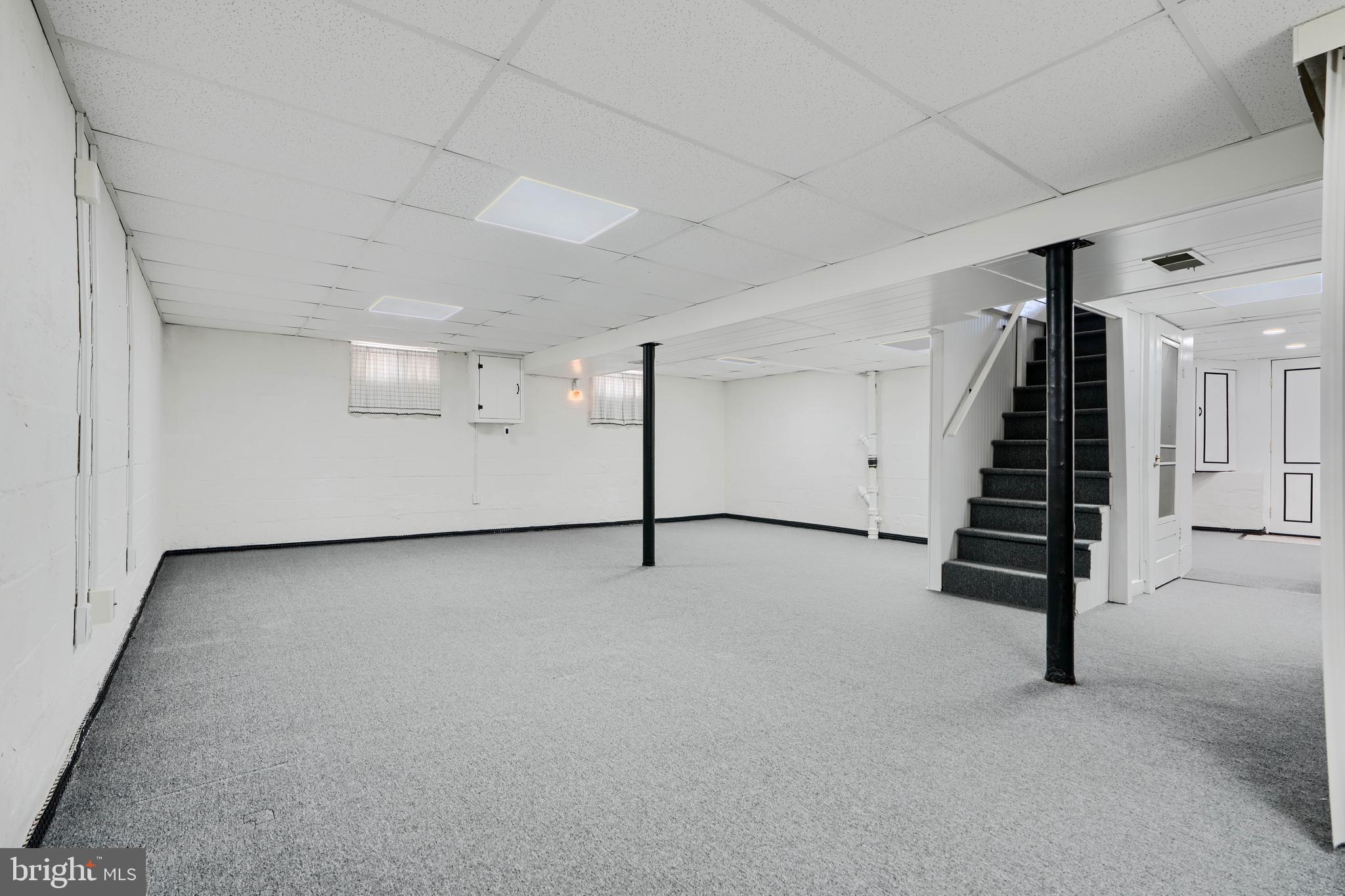 209 Middle River Road Baltimore, MD 21220 - Photo 27 of 35 a view of an empty room with stairs