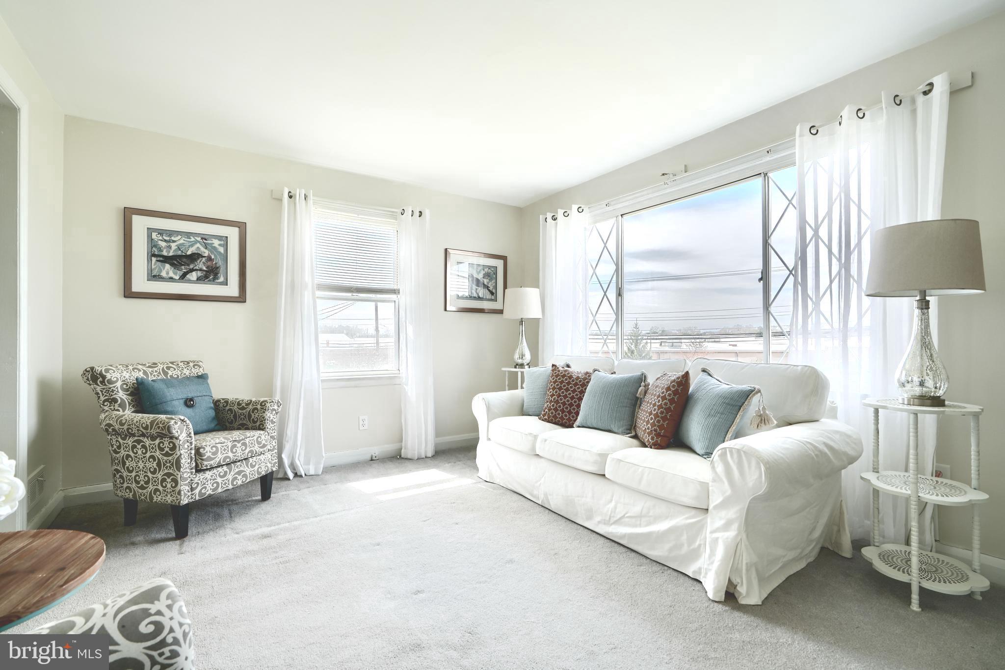209 Middle River Road Baltimore, MD 21220 - Photo 3 of 35 a living room with furniture and a large window