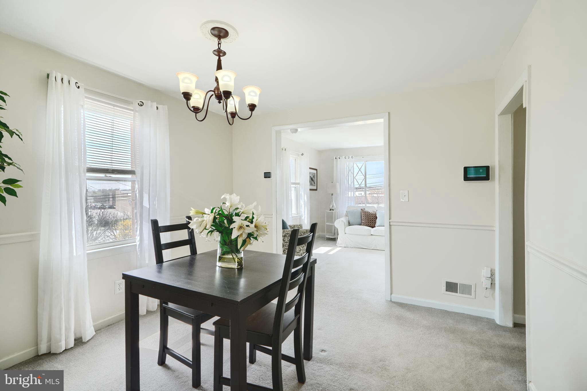 209 Middle River Road Baltimore, MD 21220 - Photo 6 of 35 a dining room with furniture and chandelier