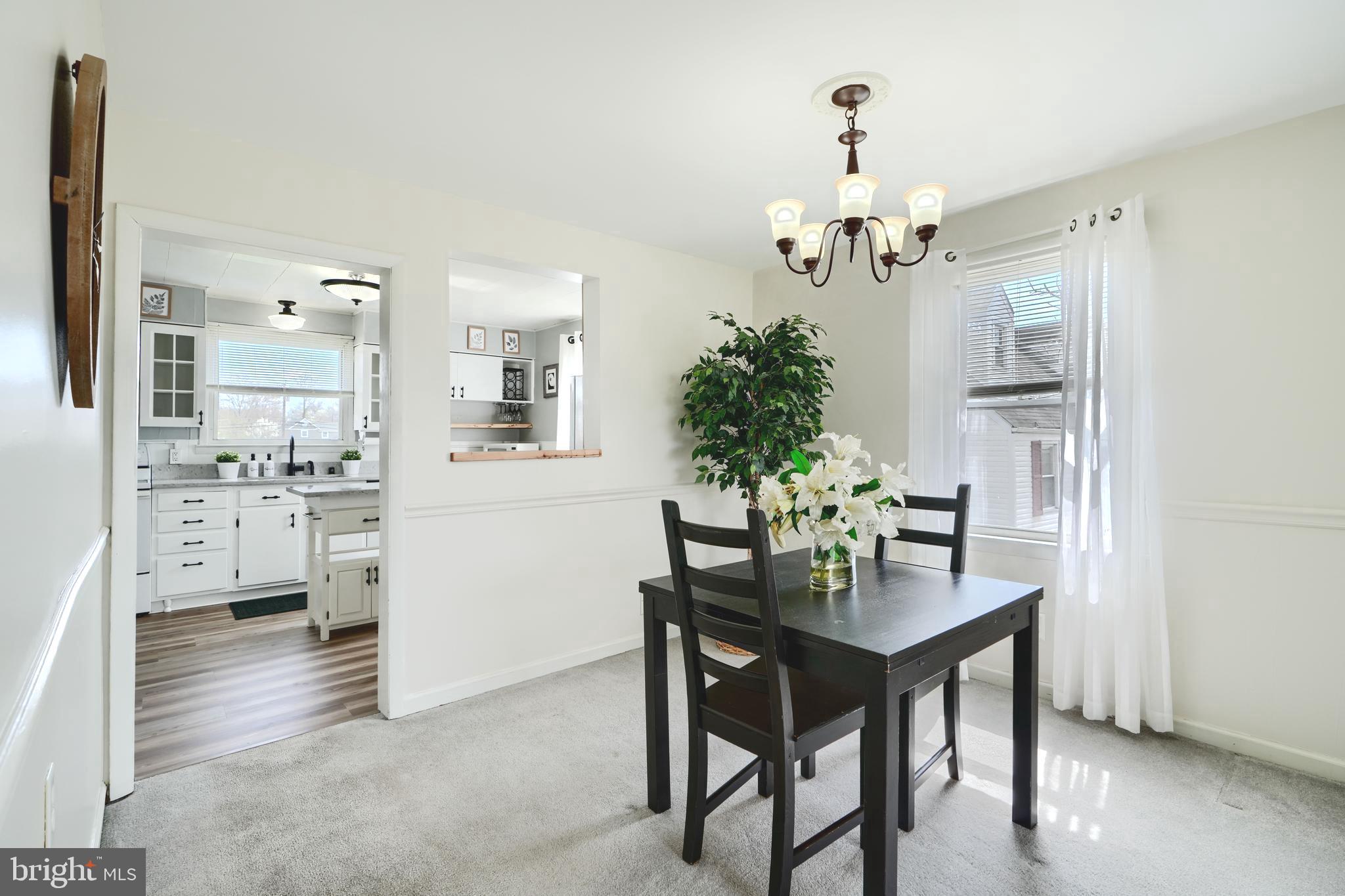 209 Middle River Road Baltimore, MD 21220 - Photo 8 of 35 a dining room with furniture and chandelier