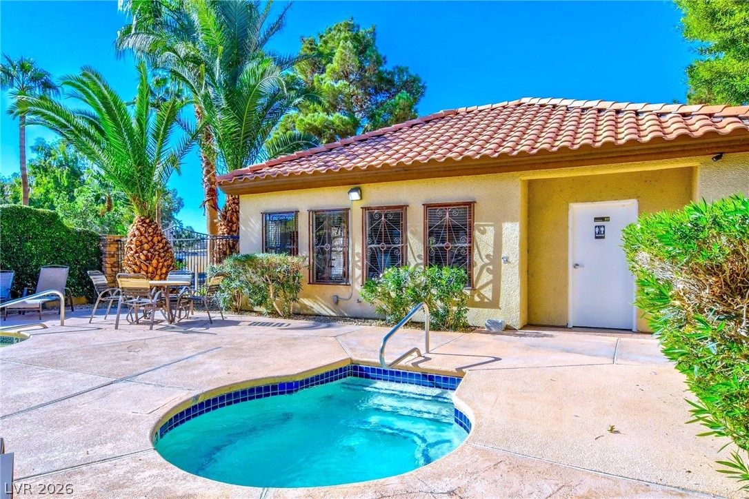 3135 South Mojave Road, Unit 156 Las Vegas, NV 89121 - Photo 15 of 18 A tranquil courtyard features a sparkling spa alongside a private seating area and lush landscaping.