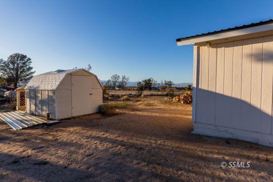 1221 Nocturne Street Ridgecrest, CA 93555 - Photo 32 of 32 a view of a backyard