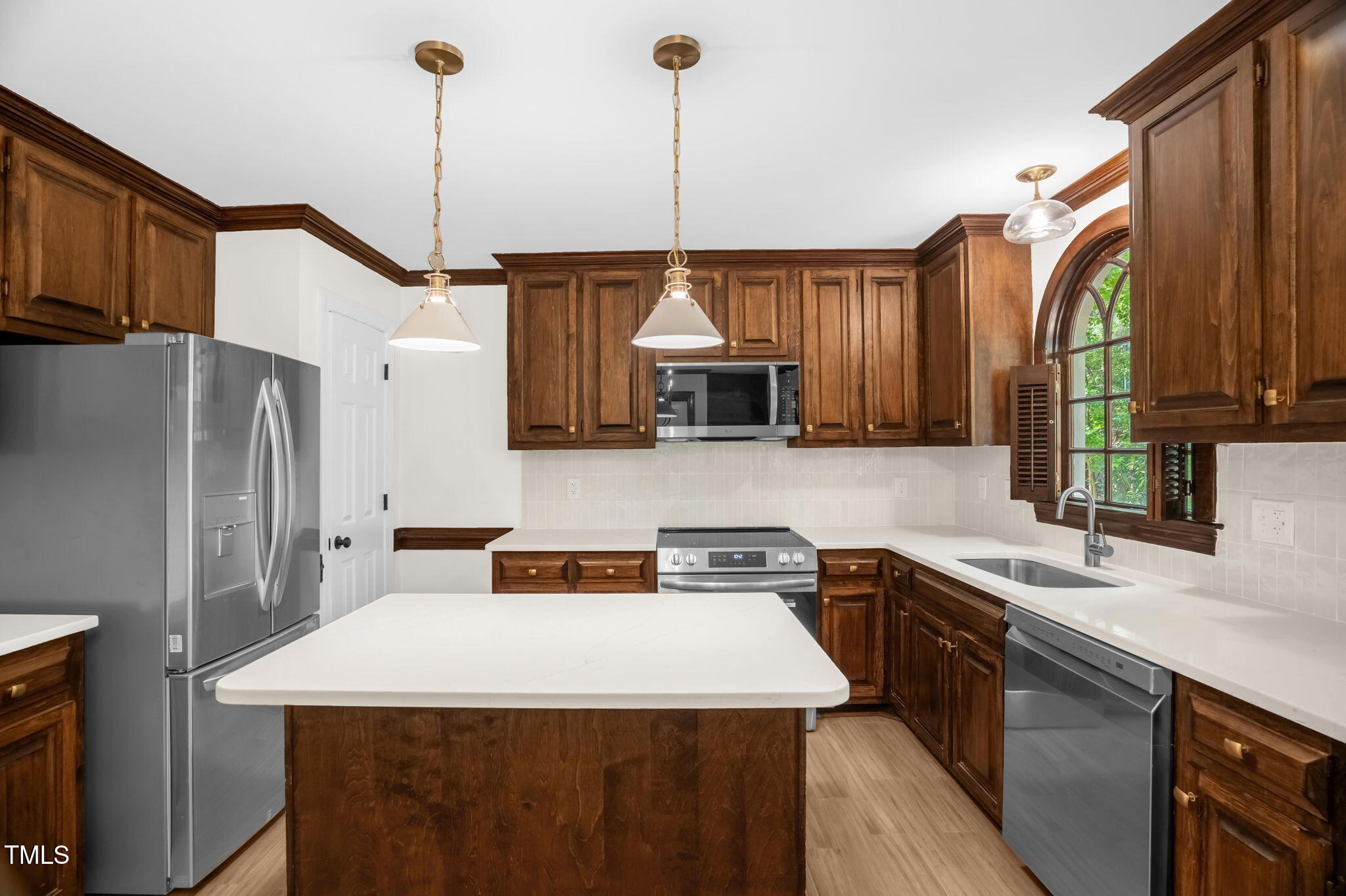 616 Cross Timbers Drive Durham, NC 27713 - Photo 17 of 29 a kitchen with stainless steel appliances granite countertop a sink a stove and a refrigerator