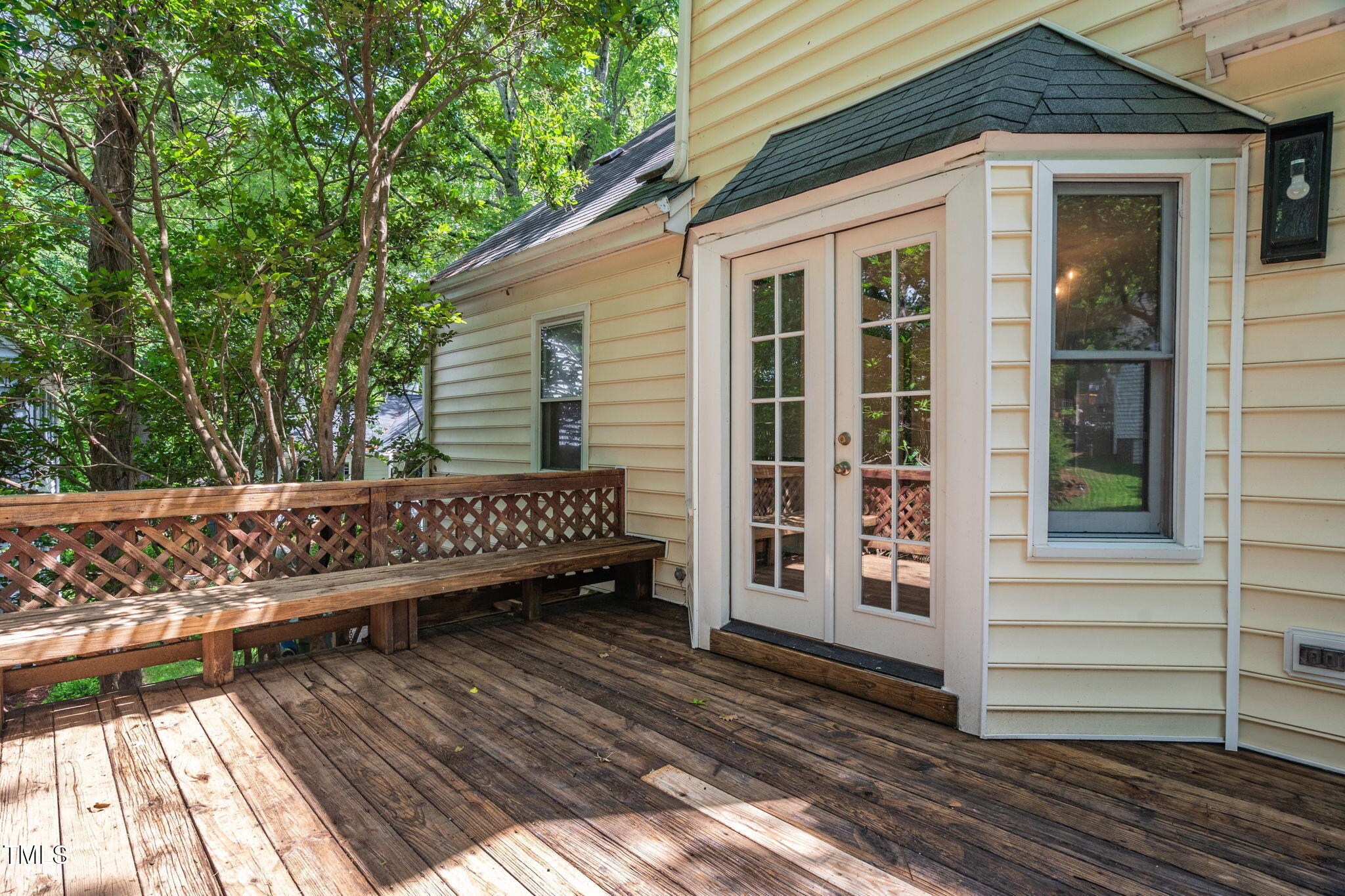 616 Cross Timbers Drive Durham, NC 27713 - Photo 18 of 29 a view of a wooden deck with a bench