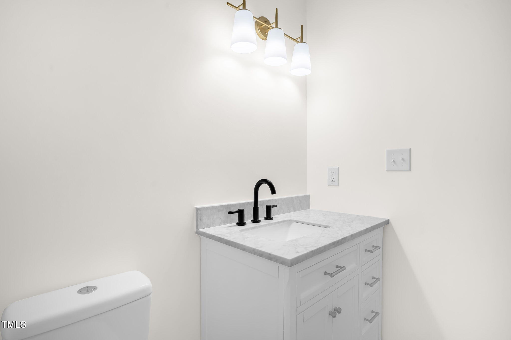 616 Cross Timbers Drive Durham, NC 27713 - Photo 22 of 29 a bathroom with a sink a toilet and mirror