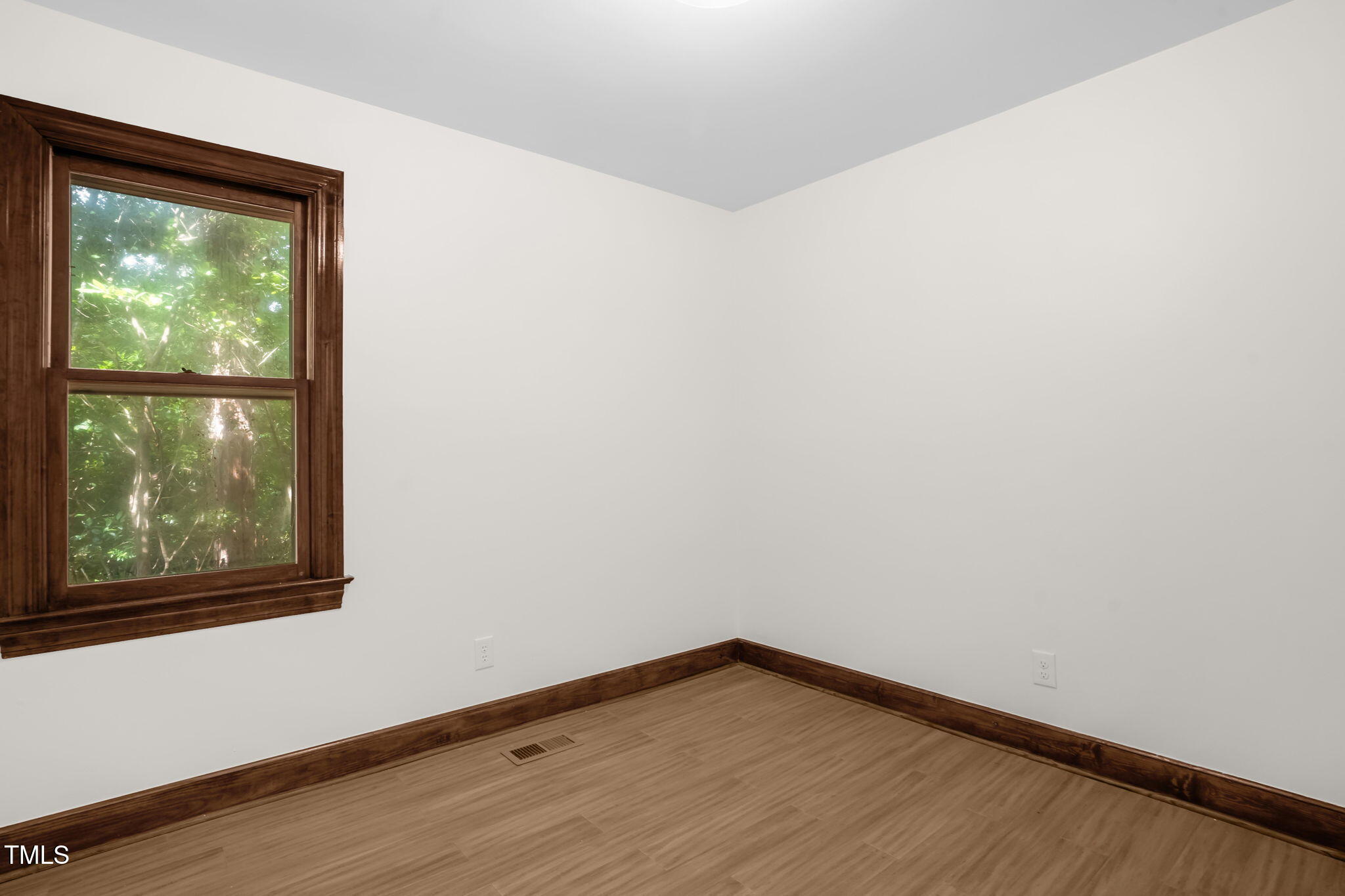 616 Cross Timbers Drive Durham, NC 27713 - Photo 29 of 29 a view of empty room with wooden floor and fan