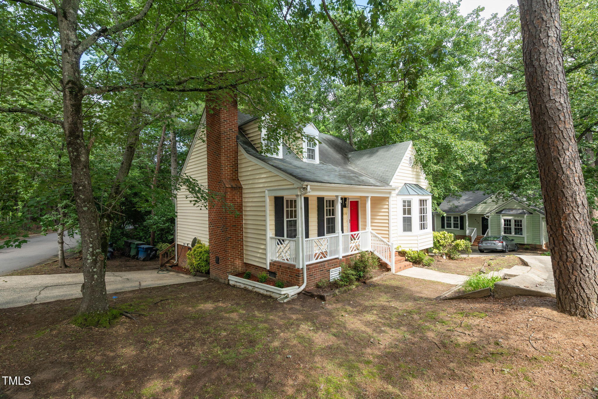 616 Cross Timbers Drive Durham, NC 27713 - Photo 5 of 29 a front view of a house with a yard and trees