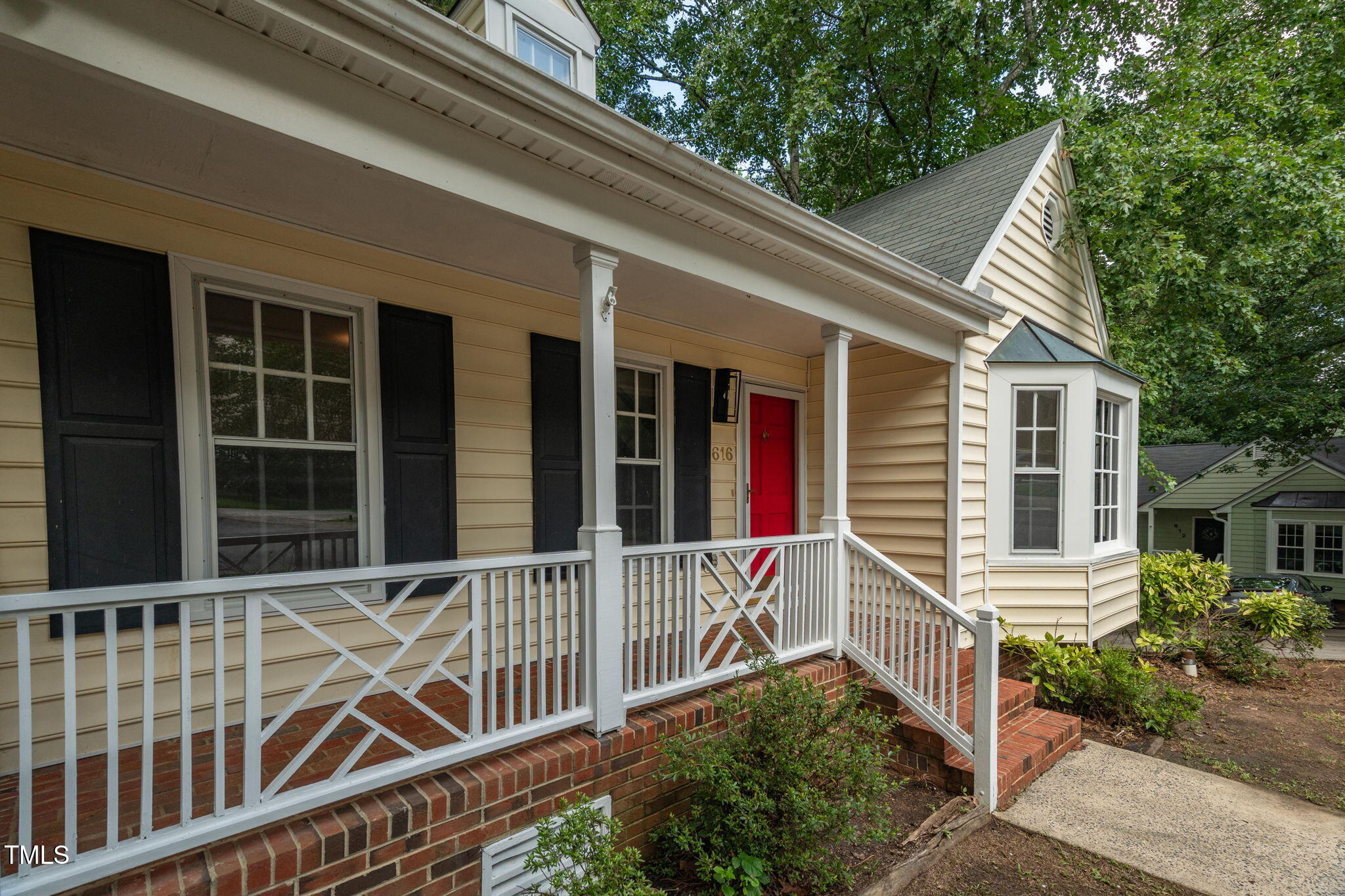 616 Cross Timbers Drive Durham, NC 27713 - Photo 6 of 29 a view of a house with a small deck and a large window