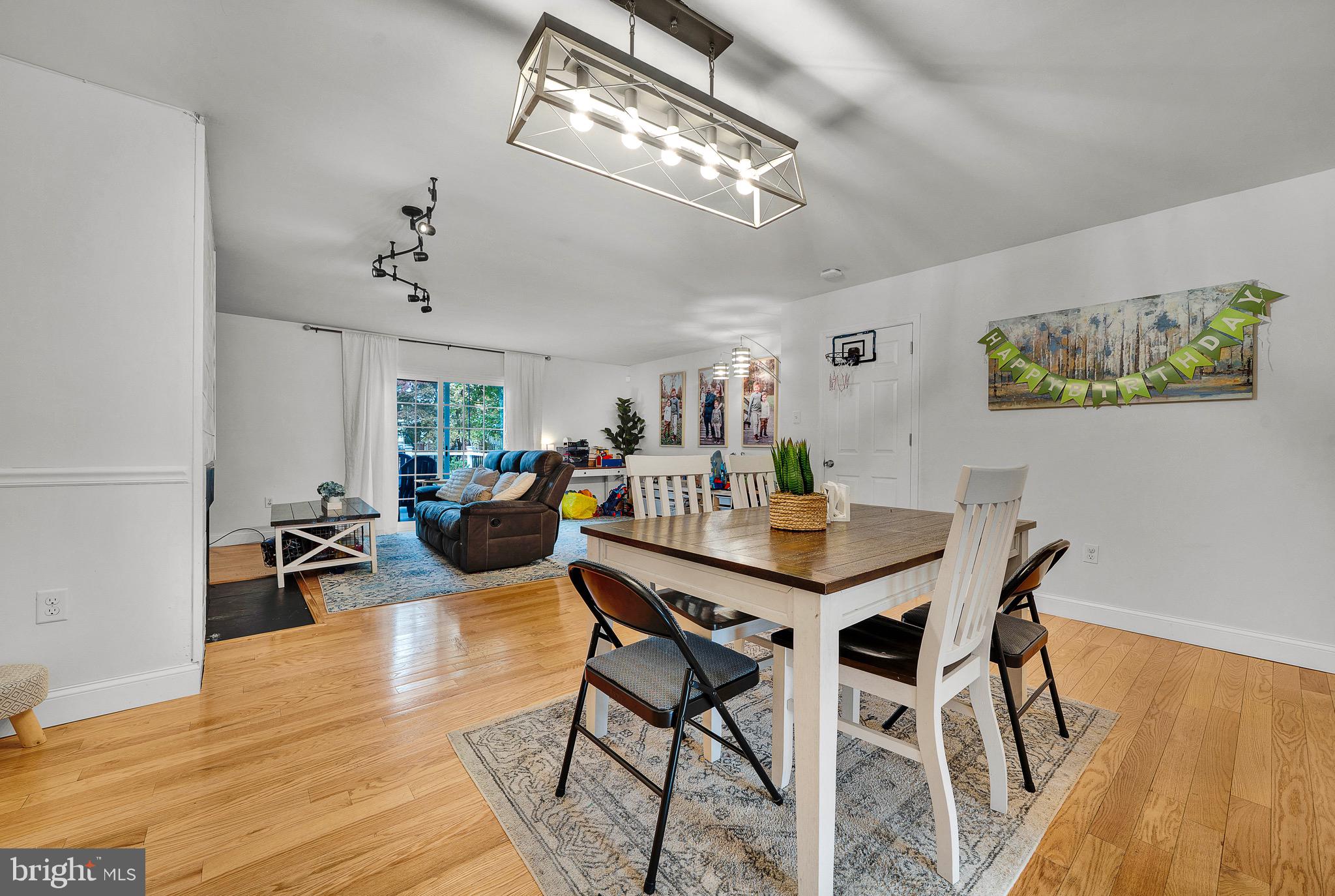 301 Cherokee Circle Ambler, PA 19002 - Photo 16 of 39 a view of a dining room with furniture and wooden floor