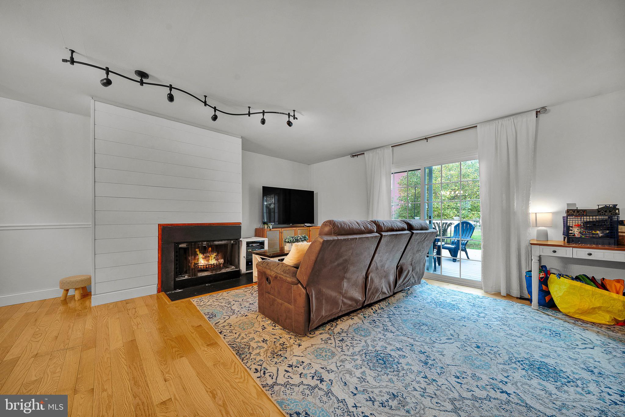 301 Cherokee Circle Ambler, PA 19002 - Photo 23 of 39 a living room with furniture and a fireplace