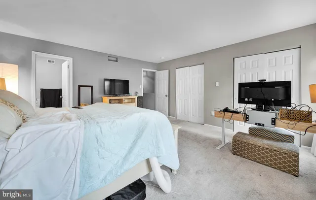 a bedroom with a bed and furniture