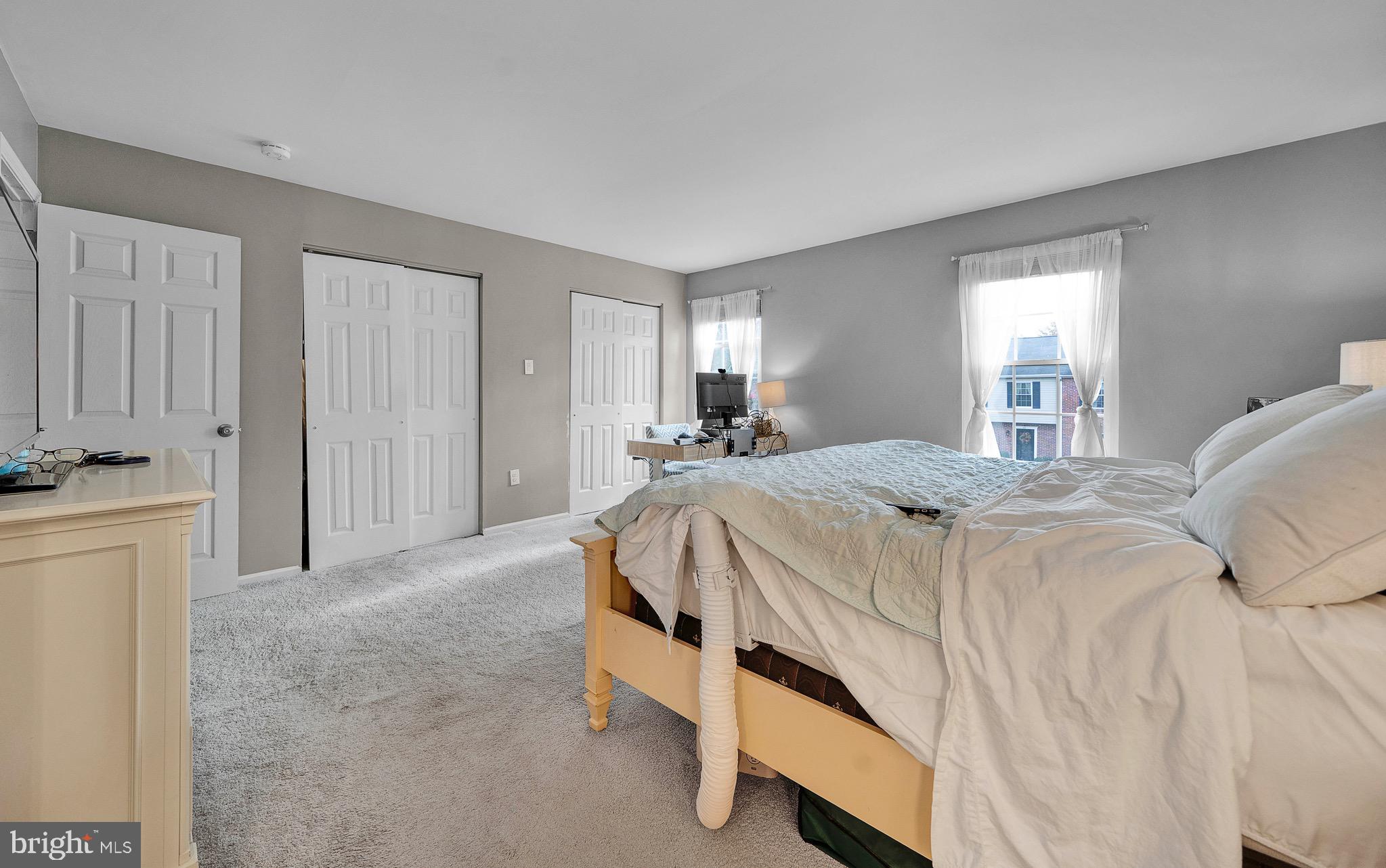 301 Cherokee Circle Ambler, PA 19002 - Photo 27 of 39 a spacious bedroom with a bed and a window