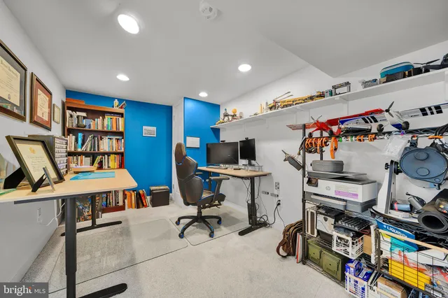 a view of a workspace with furniture