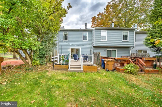 a view of a house with backyard porch and sitting area