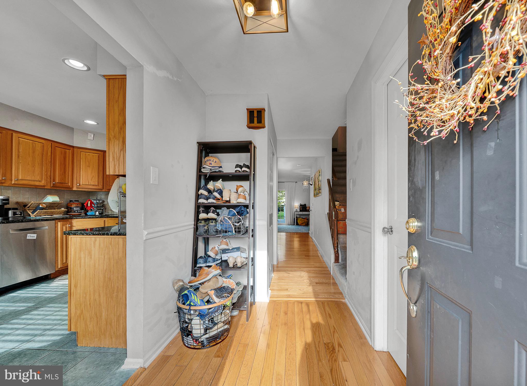 301 Cherokee Circle Ambler, PA 19002 - Photo 9 of 39 a view of a hallway with wooden floor and dining room