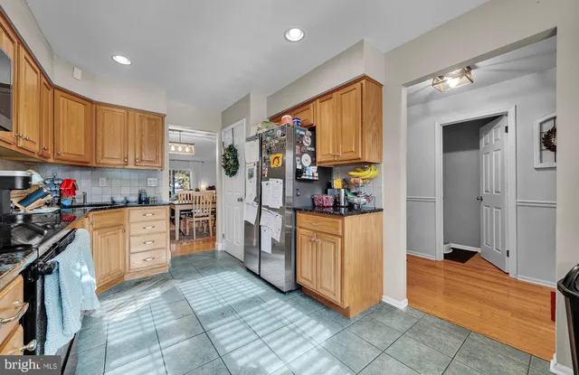a kitchen with window and cabinets