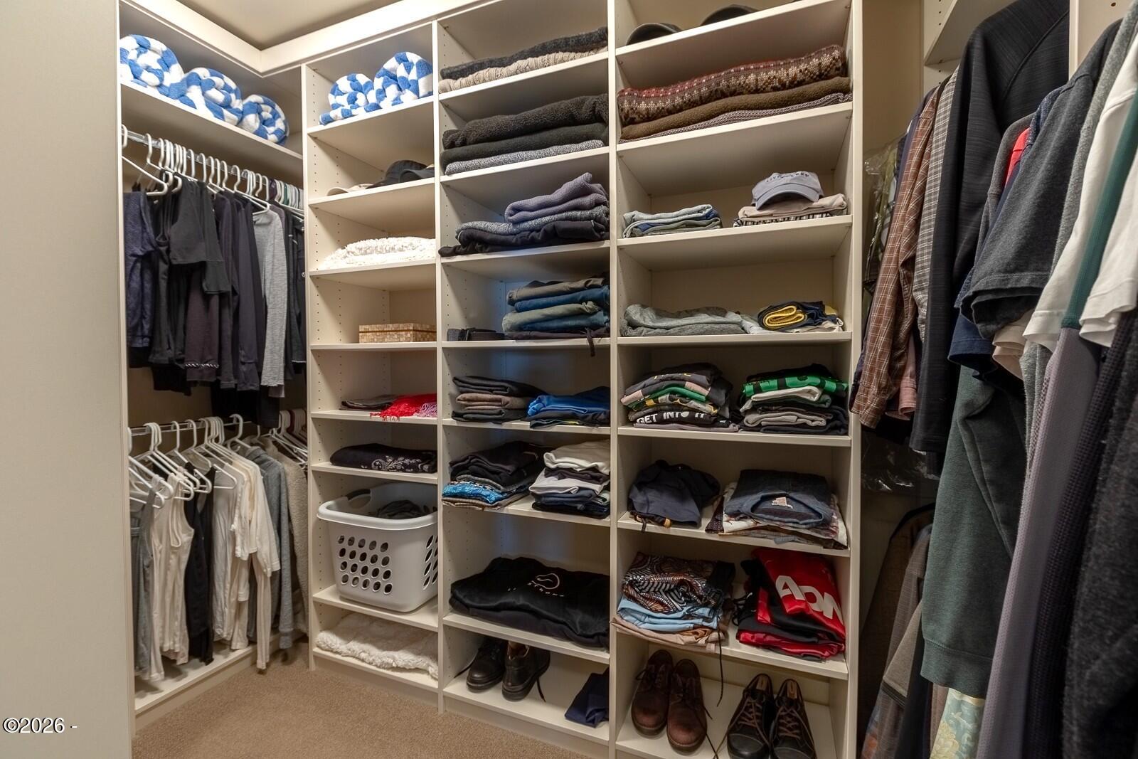 142 East Bay Point Road Gleneden Beach, OR 97388 - Photo 23 of 49 a view of walk in closet with clothes and shoes
