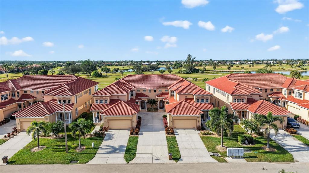 an aerial view of houses with yard