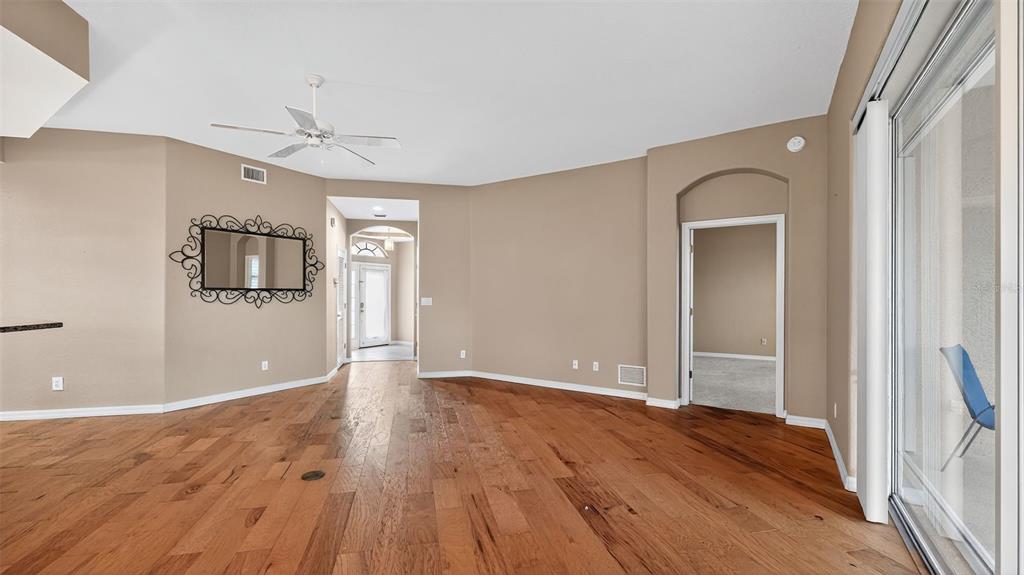 3959 San Rocco Drive, Unit 412 Punta Gorda, FL 33950 - Photo 16 of 41 wooden floor in an empty room with a window