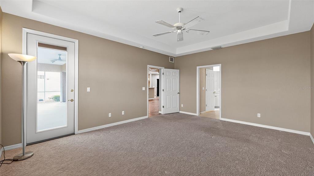 3959 San Rocco Drive, Unit 412 Punta Gorda, FL 33950 - Photo 25 of 41 a view of an empty room with a chandelier fan