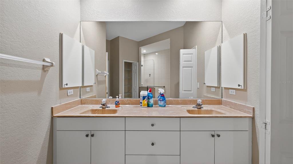 3959 San Rocco Drive, Unit 412 Punta Gorda, FL 33950 - Photo 27 of 41 a bathroom with double sink and a mirror