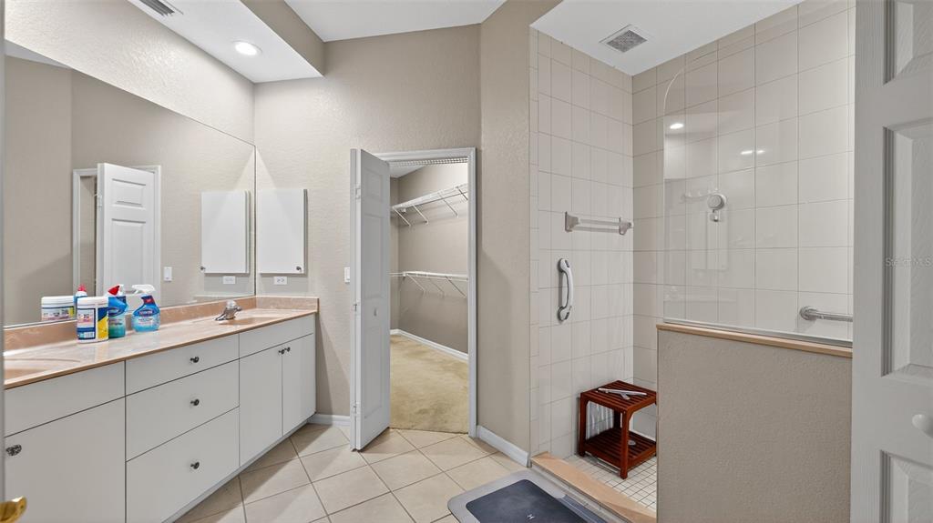 3959 San Rocco Drive, Unit 412 Punta Gorda, FL 33950 - Photo 28 of 41 a bathroom with a double vanity sink mirror and double