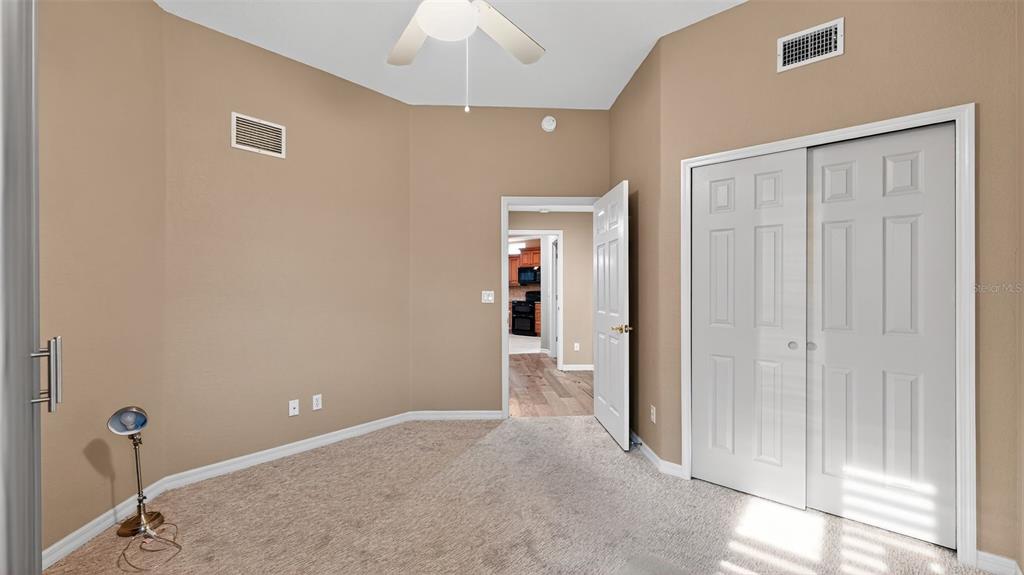 3959 San Rocco Drive, Unit 412 Punta Gorda, FL 33950 - Photo 29 of 41 a view of a livingroom with wooden floor and chandelier