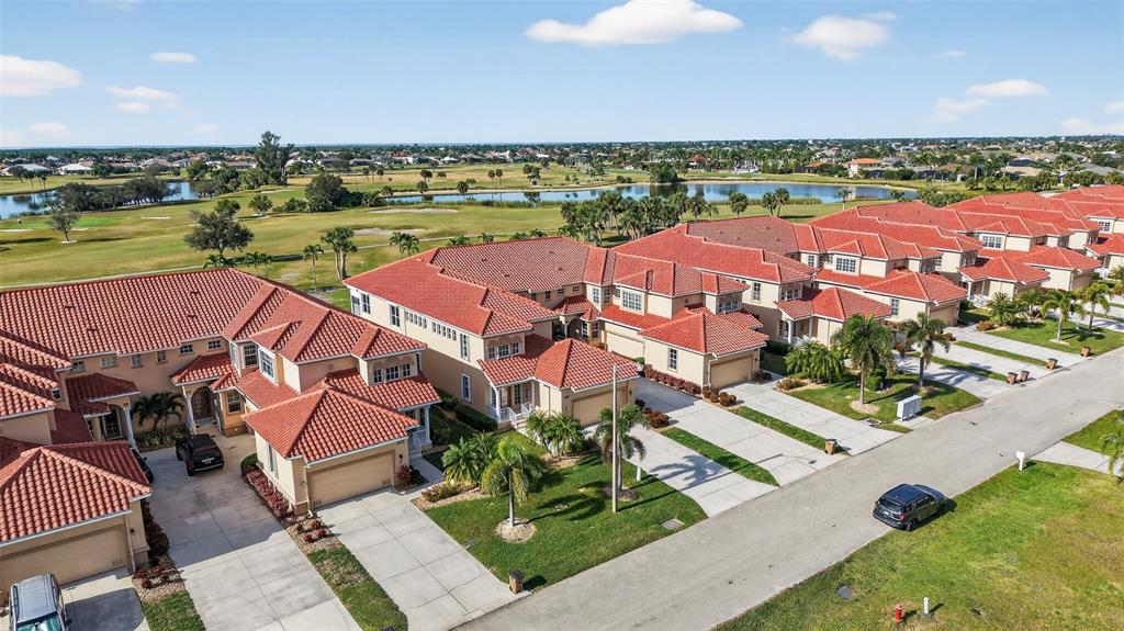 3959 San Rocco Drive, Unit 412 Punta Gorda, FL 33950 - Photo 37 of 41 an aerial view of residential houses with outdoor space and ocean view