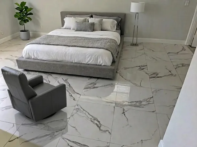 a bedroom with a bed and a couch