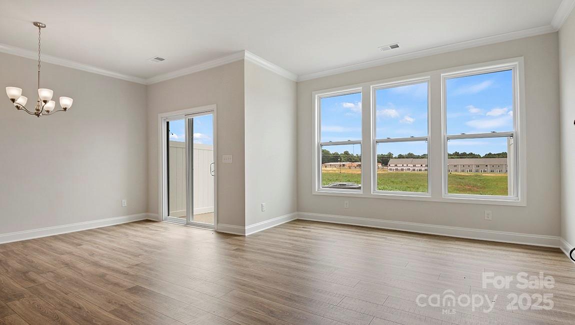 347 Lagoon Road Fletcher, NC 28732 - Photo 13 of 28 an empty room with wooden floor and windows