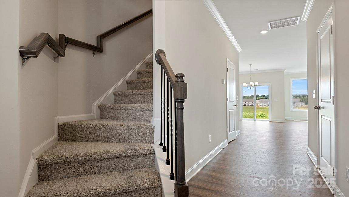 347 Lagoon Road Fletcher, NC 28732 - Photo 14 of 28 a view of a hallway with wooden floor and staircase