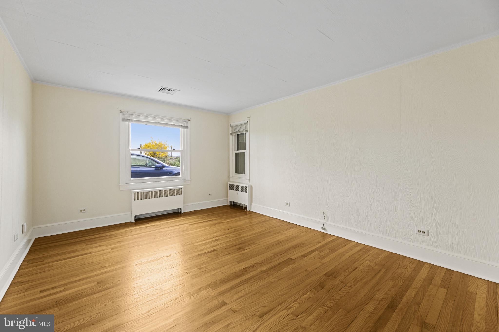 9265 Ramey Road Marshall, VA 20115 - Photo 15 of 49 an empty room with wooden floor and window