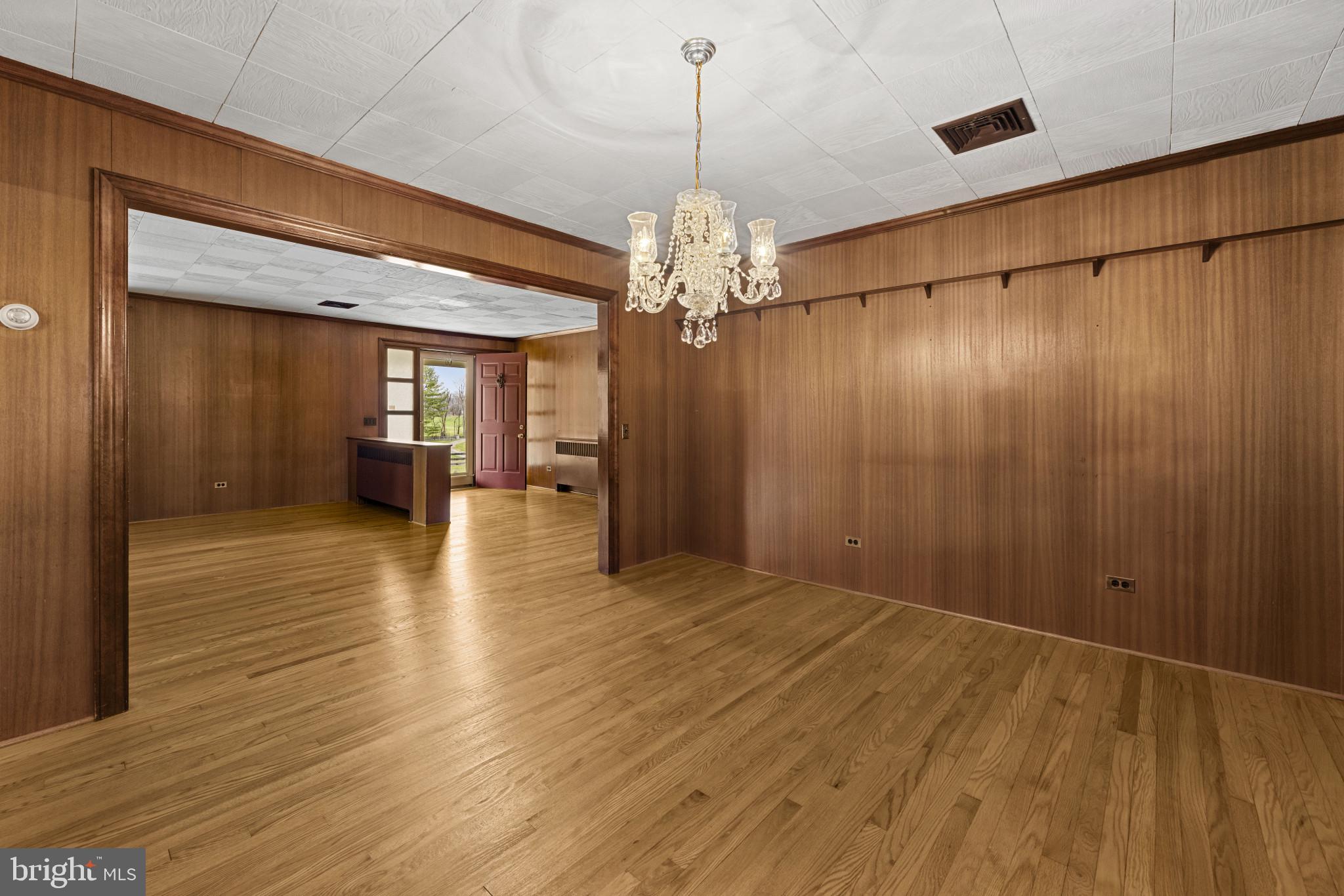 9265 Ramey Road Marshall, VA 20115 - Photo 23 of 49 a view of a livingroom with a furniture wooden floor and chandelier