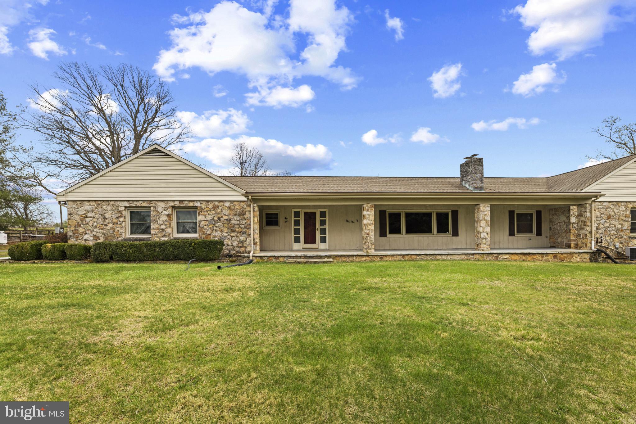 9265 Ramey Road Marshall, VA 20115 - Photo 3 of 49 a front view of a house with a garden