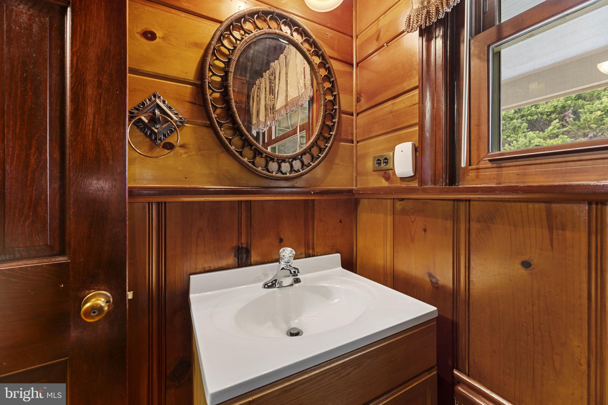 9265 Ramey Road Marshall, VA 20115 - Photo 7 of 49 a bathroom with a sink and a mirror