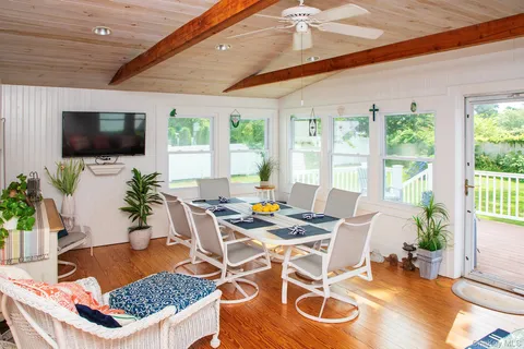 a spacious bathroom with a granite countertop sink and a mirror