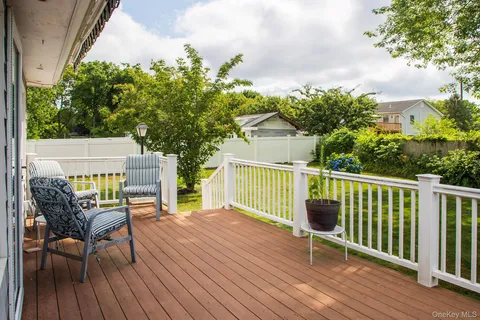 a view of a wooden deck with a bench